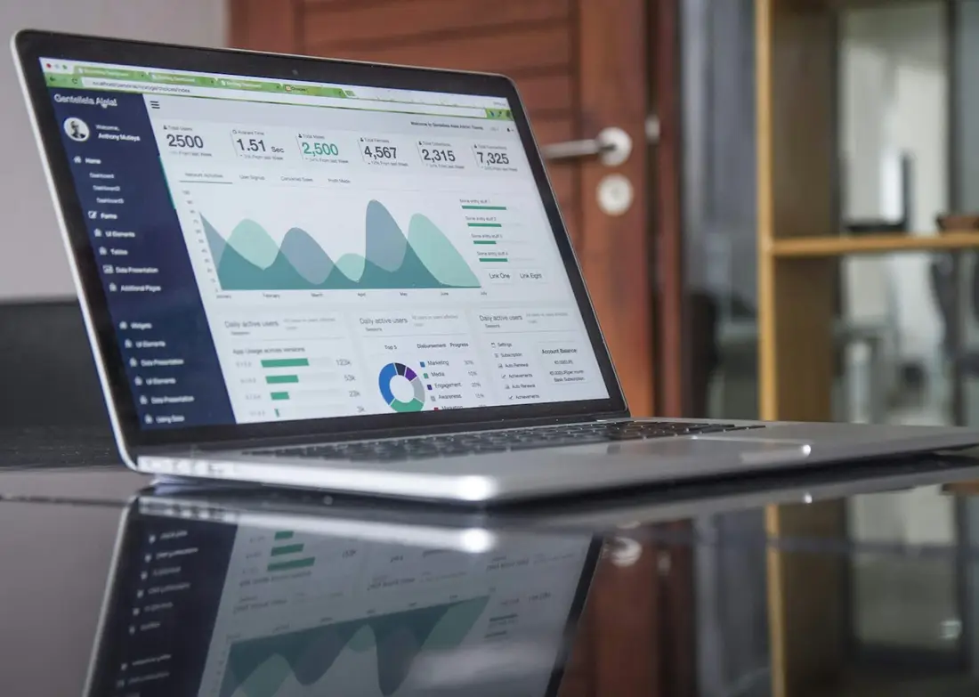 Laptop on a desk showing an analytics report